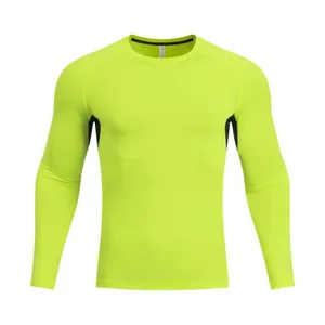 Front view of men's fluorescent yellow long-sleeve compression shirt for fitness and running.