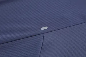 Close-up detail of men's quick-dry athletic t-shirt showing breathable fabric and reflective logo