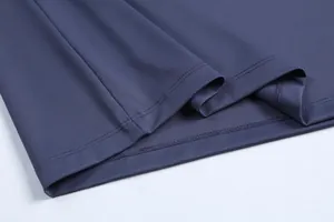 Close-up of durable hem stitching on a breathable navy quick-dry sports T-shirt