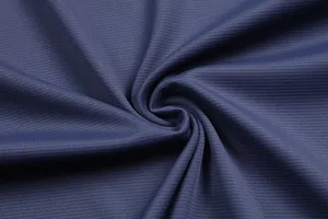 Macro view of blue quick-dry honeycomb mesh fabric for men's athletic T-shirt