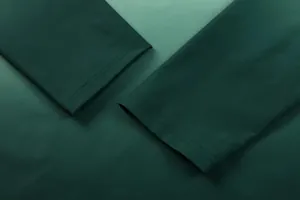 Detail showing the double-stitched cuffs of a dark green quick-dry outdoor sports shirt