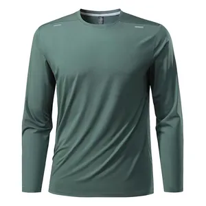 Close-up front view of a dark teal long-sleeve quick-dry athletic t-shirt with reflective details