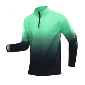 Detail view of men's athletic quarter-zip shirt with mint green to black gradient design