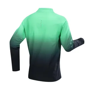 Rear view of men's long sleeve half-zip sports top with green to black gradient design.