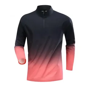 Detail view of men's half-zip long sleeve athletic shirt featuring a gradient color design