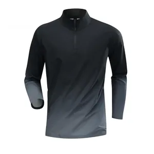 Detail of men's half-zip athletic top with stand collar and grey gradient effect.