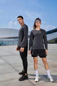 Full-body view of quick-drying long-sleeved sports T-shirts for men and women in outdoor setting