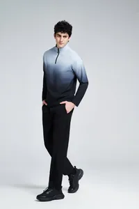 Full body view of a man wearing a grey-to-black gradient half-zip athletic long sleeve