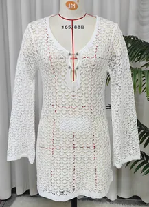 Elegant white crochet beach cover-up dress with hollow-out pattern and metal bar detail