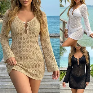Detail view of women's crochet beach cover-up dress with metal bead neck detail