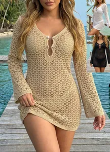 Detail shot of a sexy long sleeve crochet beach dress with metal ring accents