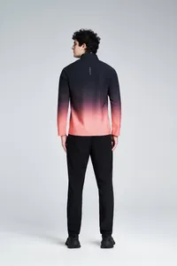 Back view of men's long-sleeve quick-dry sports top featuring a black to coral gradient