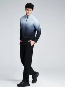 Men's half-zip athletic shirt with a blue-to-black gradient for outdoor running and fitness.