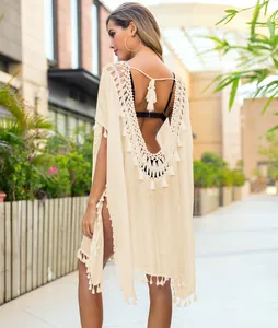 Elegant beige boho crochet beach cover-up with tassels and sexy backless design
