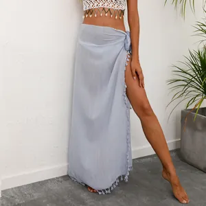 Detailed view of the light blue wrap beach skirt featuring delicate tassel trim edges.
