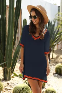 Loose navy blue boho beach cover-up with vibrant orange crochet hollow-out V-neck