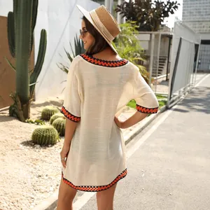 Bohemian hand-crocheted beach cover-up featuring contrast hollow stitching and loose fit