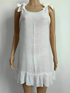 Detailed shot of white summer beach cover-up dress featuring adjustable tie-up bow straps