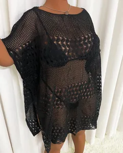 Detailed view of plus size black crochet mesh beach cover-up with intricate hollow-out patterns.