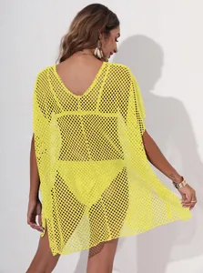 Back view of vibrant yellow mesh beach cover-up dress with sheer fishnet texture