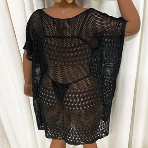 Back view of plus size black crochet beach cover-up with hollow-out mesh pattern