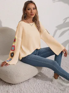 Elegant women's boat neck loose knit sweater featuring unique colorful crochet flower sleeves
