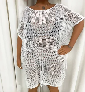 Detailed view of a white hollow-out crochet beach cover-up dress for plus size women.