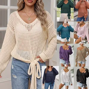 Detailed view of women's hollow-out V-neck knit sweater in multiple colors