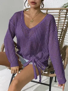 Detailed view of purple hollow-out knit cover-up with V-neck and side tie bow