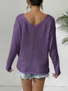 Macro view showing the detailed hollow-out knit pattern on back of purple V-neck top