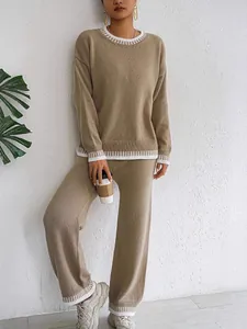 Casual women's khaki knitted two-piece set with white striped trim and wide-leg pants.