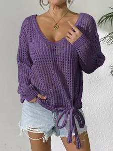 Detail view of a purple V-neck hollow-out crochet cover-up with a tie-knot hem decoration