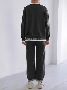 Women's two-piece knit lounge set featuring contrast trim sweater and wide-leg pants