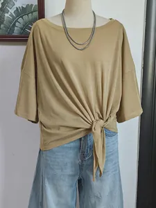 Detailed view of women's thin boat neck cover-up with stylish front knot detail