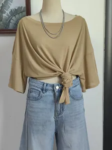 Stylish light brown boat neck cover-up top featuring a chic knotted waist tie detail