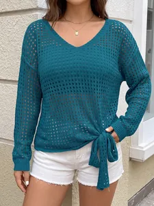 Chic teal V-neck hollow-out knit top detail featuring a stylish side bow tie hem knot