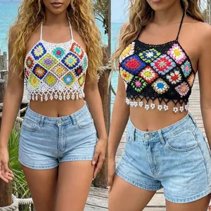 Detailed view of handmade crochet halter tops with colorful floral motifs and pearl tassels