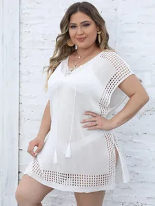 Elegant plus size white crochet beach bikini cover-up with V-neck and tassel ties