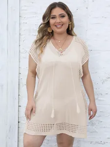 Elegant plus size beige hollow out knit beach cover up with deep V neckline and tassels