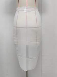 Close-up detail of the semi-transparent white chiffon beach sarong wrap on a mannequin