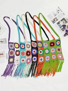 Variety of colorful vintage crochet granny square crossbody bags with bohemian fringes