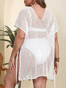 Close-up back view of a white plus-size crochet beach cover-up with side lace-up ties