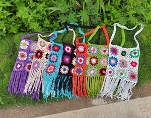 Handmade crochet granny square tassel bags in vibrant colors for a boho look.