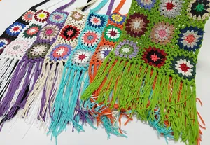 Vibrant hand-crocheted granny square crossbody bags with elegant long fringe tassels
