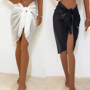 Detail of sexy semi-transparent chiffon tie-up beach wrap skirts in white and black colors