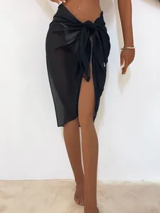 Elegant black semi-transparent chiffon beach wrap sarong skirt shown on a female mannequin
