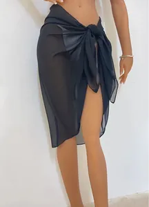 Close-up of black sheer chiffon beach wrap skirt with elegant tie-waist detail