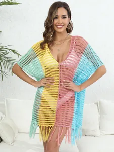 Vibrant color-block crochet beach cover-up with fringe trim and hollow-out knit design
