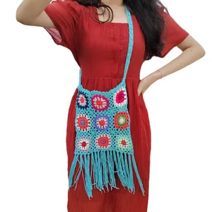 Vintage bohemian handmade crochet granny square crossbody bag with vibrant blue fringe