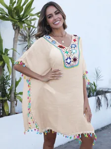 Bohemian V-neck beach cover-up with crochet flowers and colorful tassels for vacation